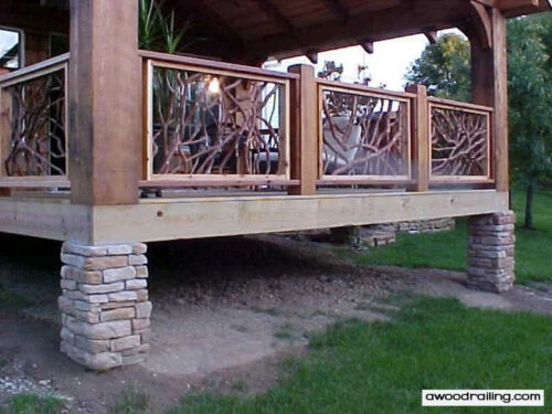 Three Mountain Laurel handrail sections on a custom porch, complemented by sturdy stone pillars.