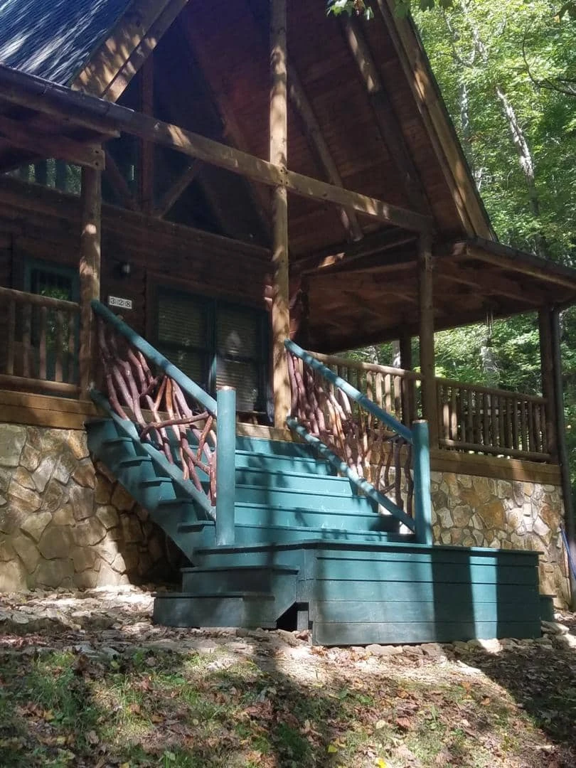Whittier, NC Log Cabin Home Green Stairs With handrails