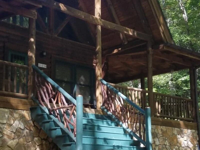 Charming painted pine log railings by Mountain Laurel Handrails, offering rustic elegance and safety for any home.