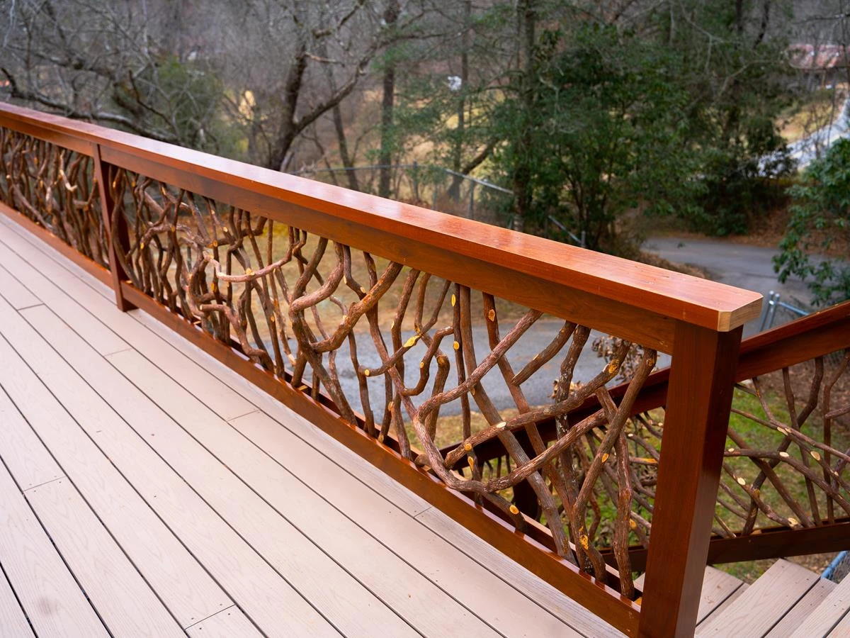Right side view of a deck featuring a mountain laurel handrail in Franklin, NC, showcasing natural beauty and craftsmanship.