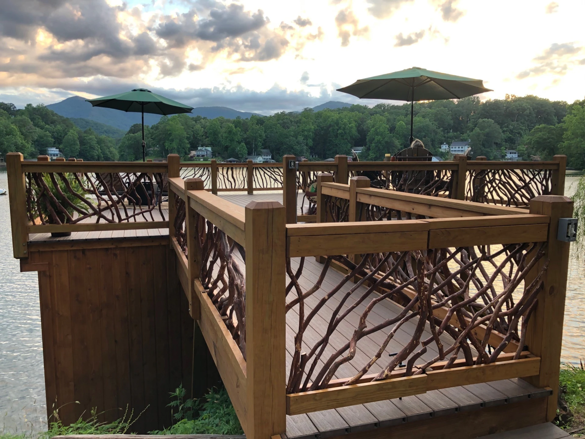 Entrance view of the dock featuring a two-door swing open gate made from mountain laurel handrails, inviting access to the waterfront.