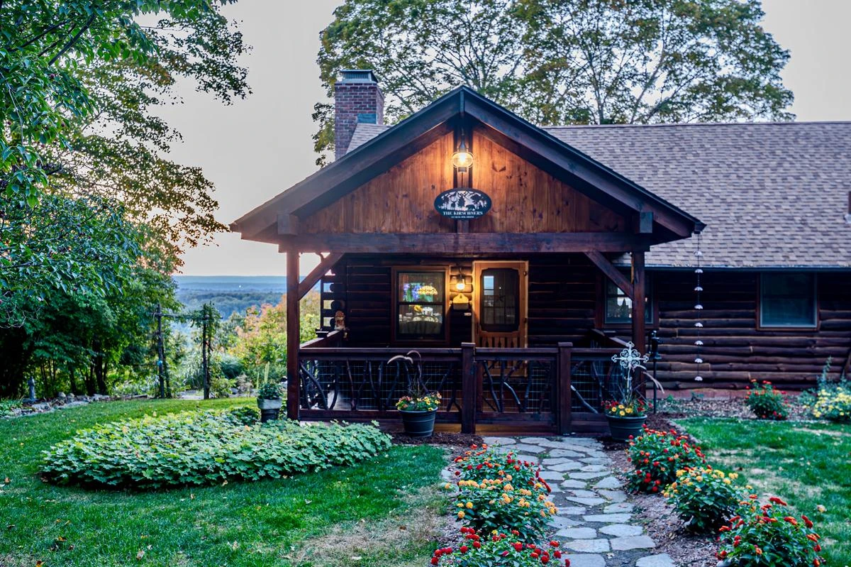Dark wooden cabin nestled in the mountains