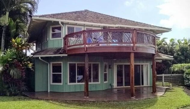 A product photo showing a full view of a curved handrail on a back porch, forming a half circle.